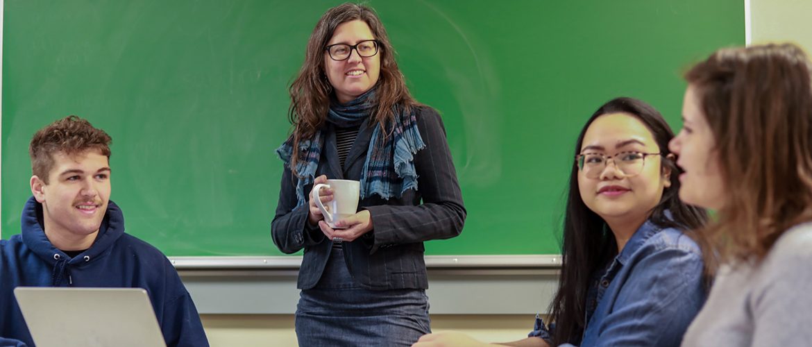 Professor at front of a classroom