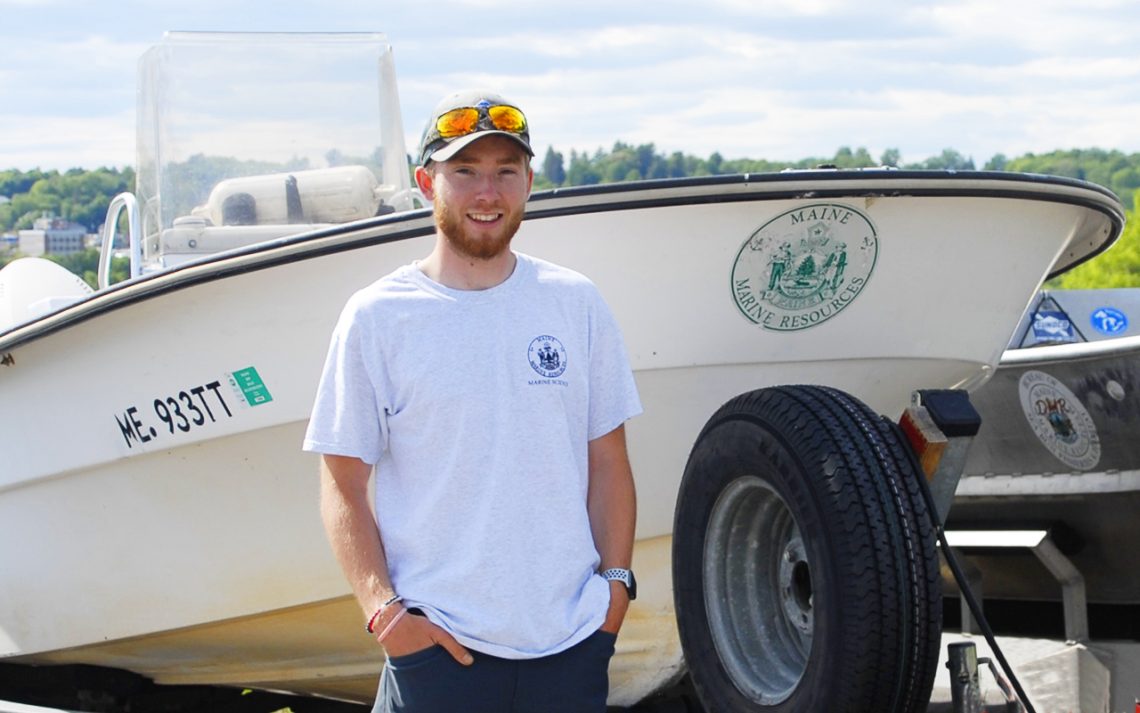 Thomas Wing, an Earth and Environmental Science graduate from the University of Maine at Farmington at his job with the Maine Department of Marine Resources.