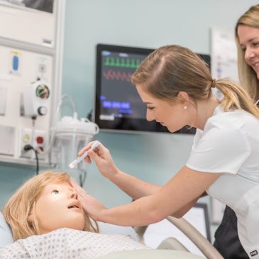 UMA Nursing student and faculty member in the UMA simulation lab.