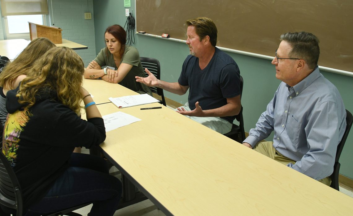 (On the right) Joseph McDonnell, UMF Interim President, joins Jeffrey Thomson, professor of creative writing, as he gets to know his Summer Experience advisees